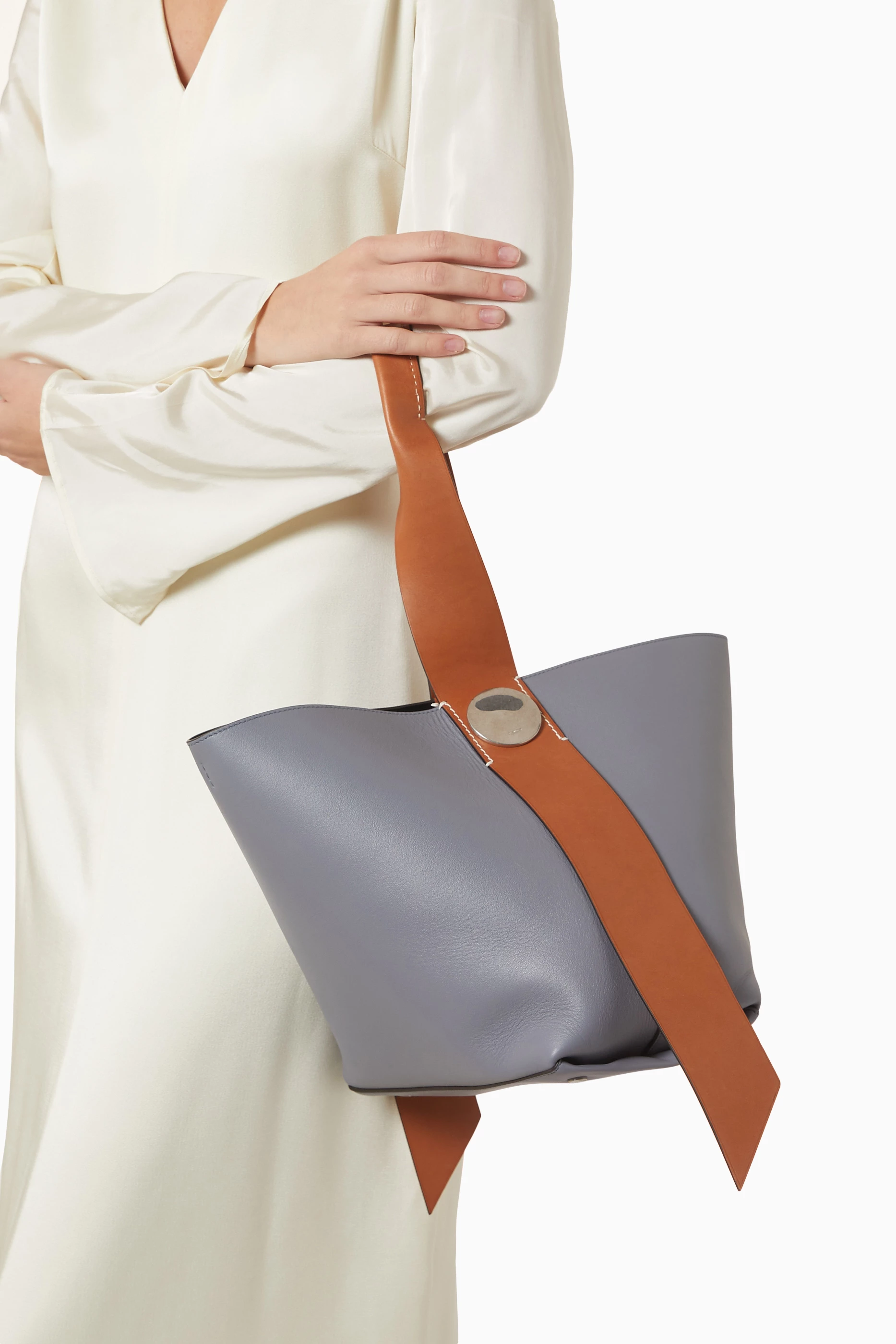 Buy Jil Sander Blue Medium Twisted Hobo Bag in Leather For