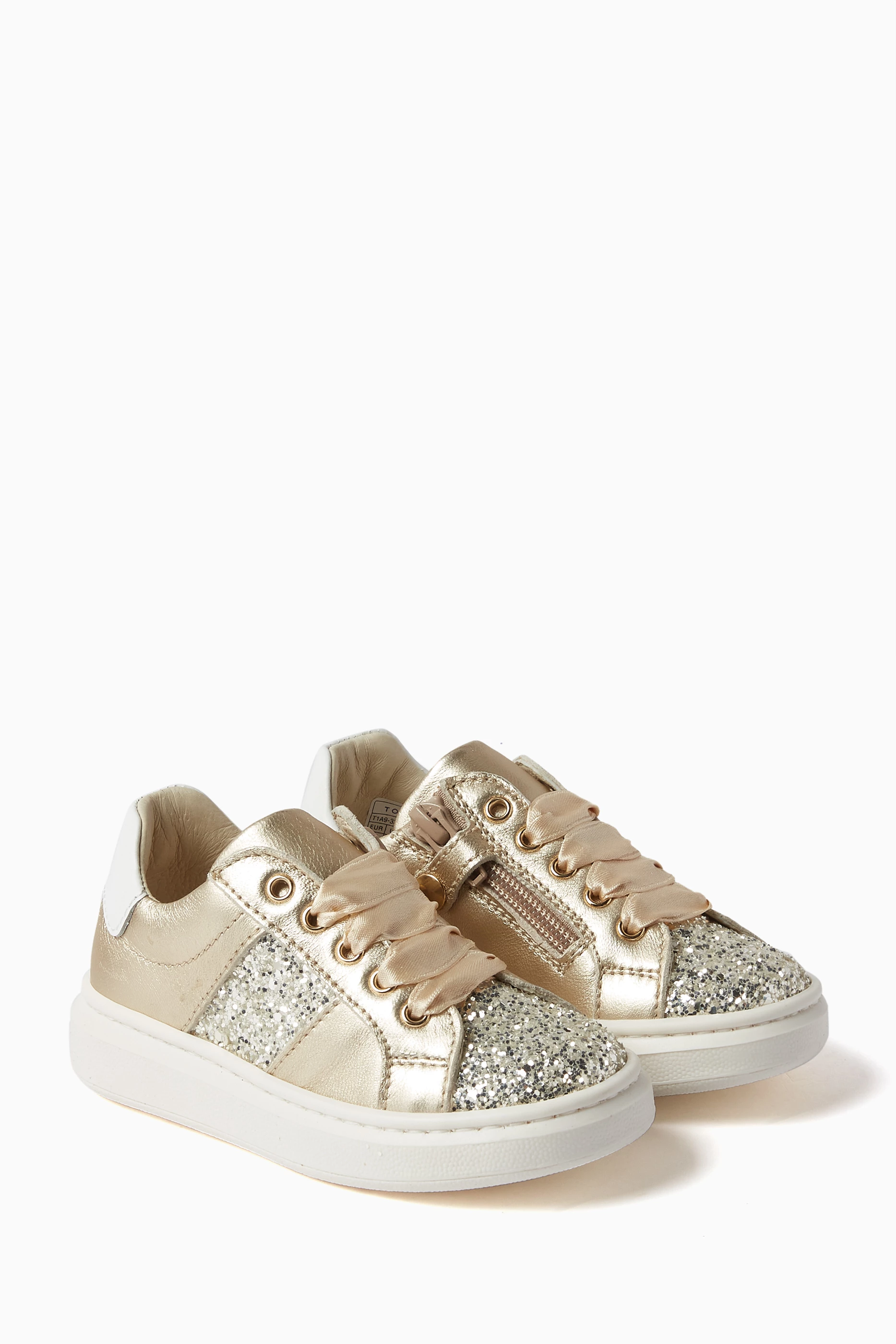 Buy Tommy Hilfiger Gold Sneakers in Glitter Metallic Leather For Girls Online Ounass UAE