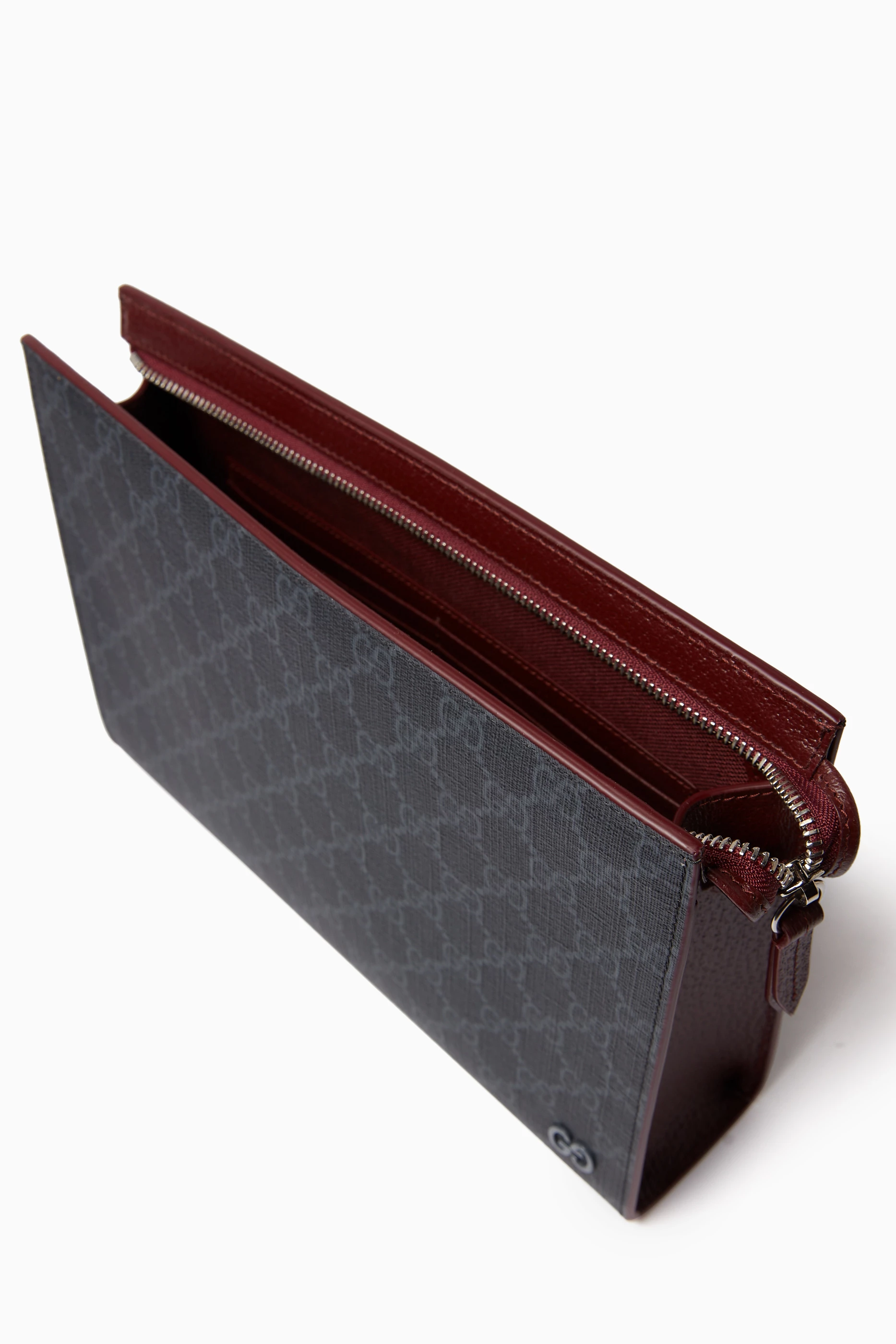 Gucci supreme pouch best sale