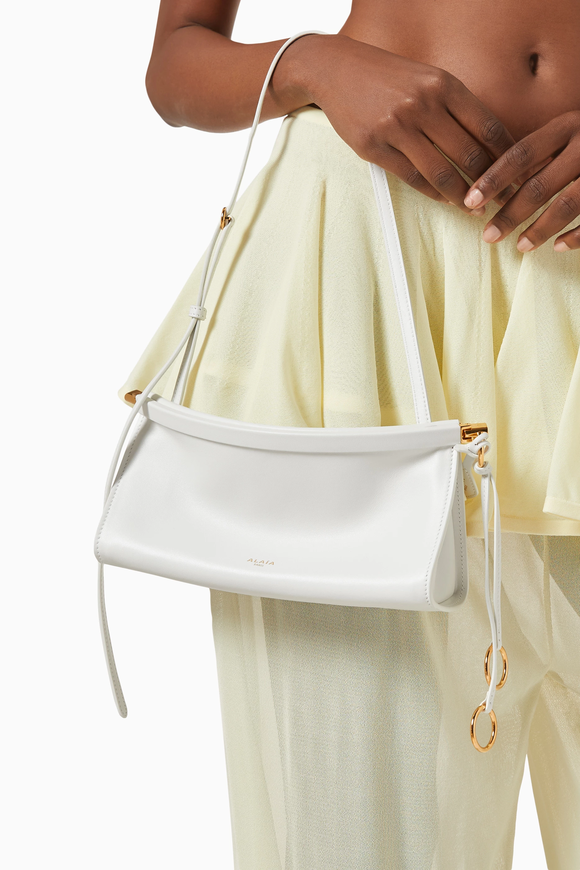 Buy Alaïa White Le Click East West Shoulder Bag in Leather