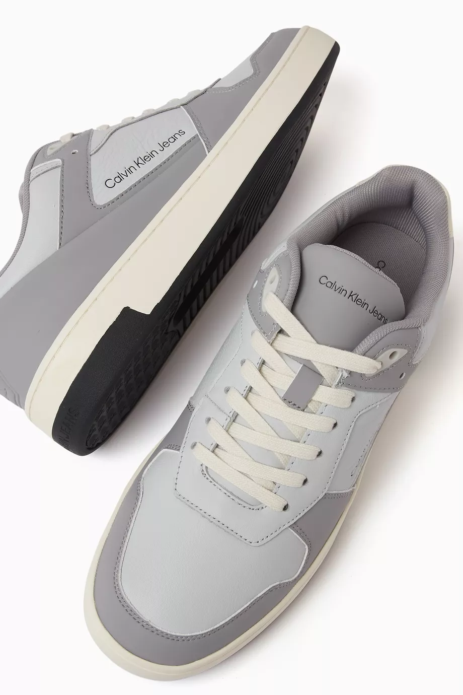 Buy Calvin Klein Jeans Grey Basket Cupsole Low top Sneakers in Faux Leather For Men Online Ounass UAE